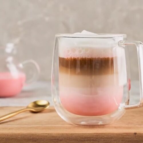Pink Drink With Vanilla Cold Foam Served in Big Jug with raspberry garnish