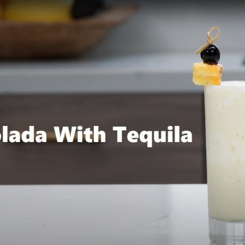 Pina Colada With Tequila Served With Black Cherry