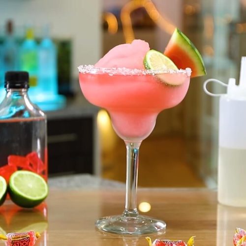 Watermelon Jolly Ranchers Drink Served in table with tequila, and lime