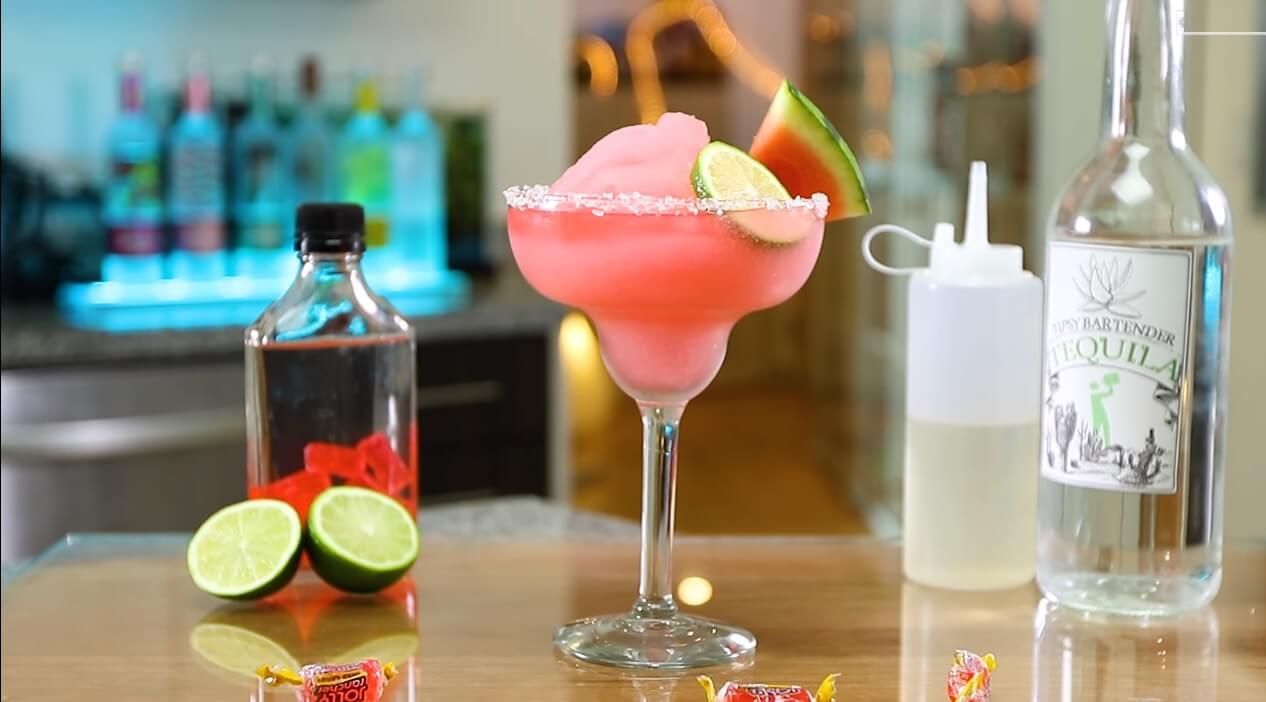 Watermelon Jolly Ranchers Drink Served in table with tequila, and lime